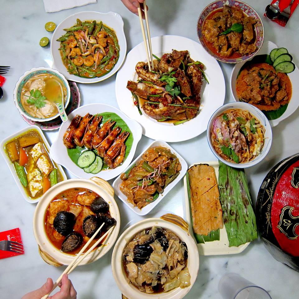 An elaborate spread of Peranakan dishes commonly consumed during celebrations. It includes chap chye (stewed mixed vegetables), sambal udang (prawn sambal), among others.
